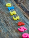 multicolored numbers for counting on wooden table
